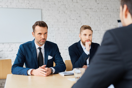 Business negotiations – three business man negotiating